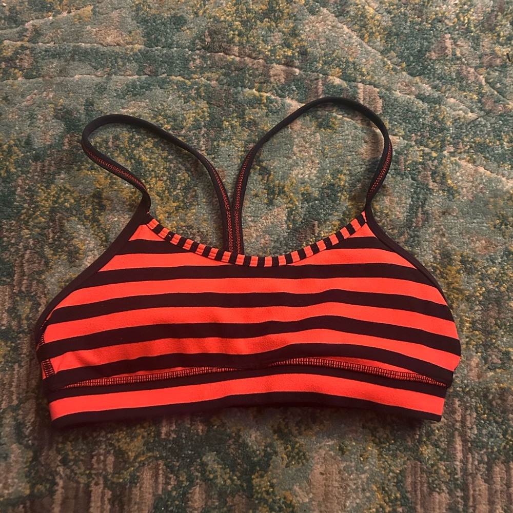 Orange, navy stripped Lululemon sports bra.